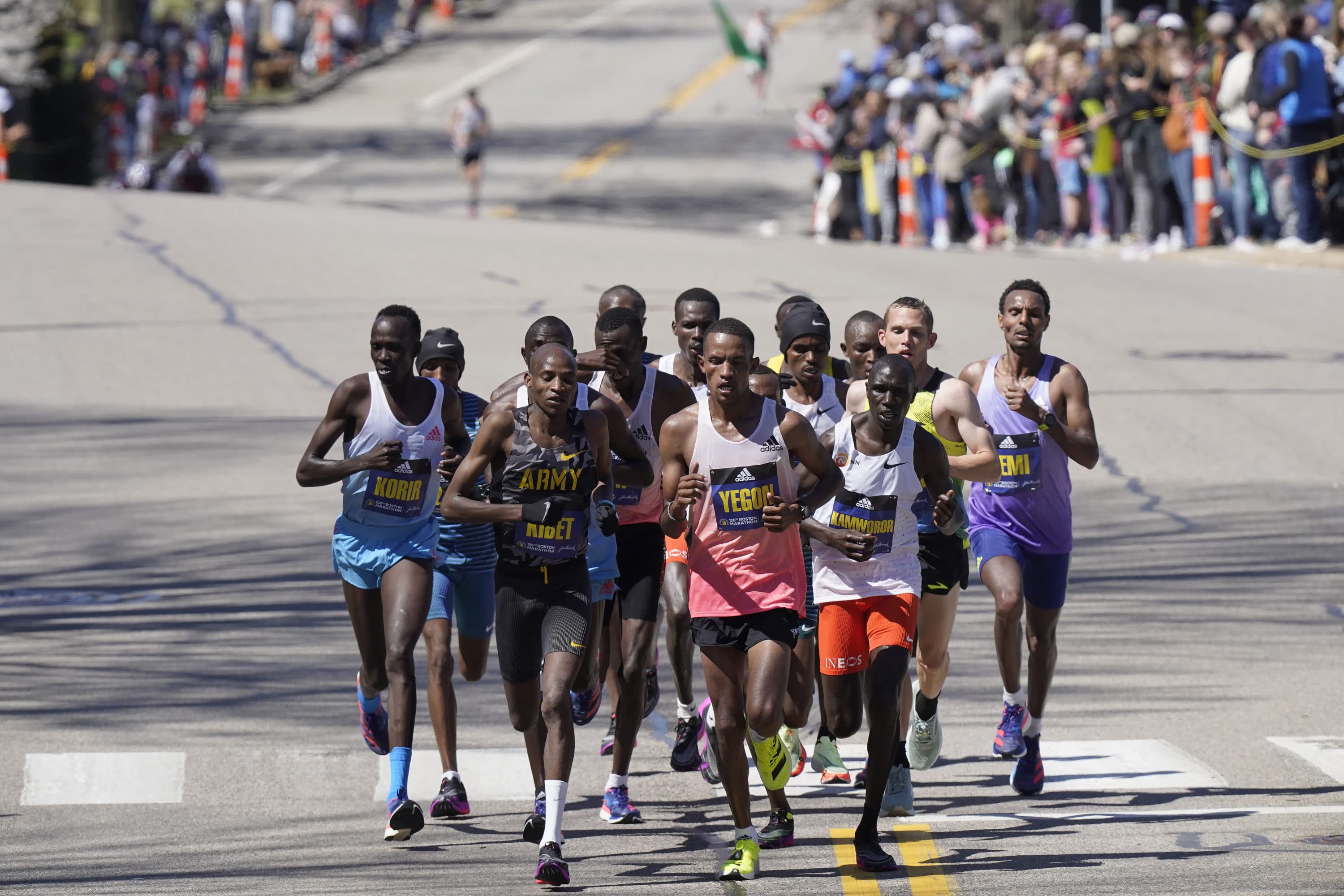 Runners in the men's division, front row from the left, Albert Korir, of Kenya, Elkanah Kibet, of Colorado Springs, Colo., Bethwell Yegon, of Kenya, and Geoffrey Kamworor, of Kenya, lead a group up Heartbreak Hill in the Boston Marathon, Monday, April 18, 2022, in Newton, Mass. (Steven Senne/AP)Runners in the men's division, front row from the left, Albert Korir, of Kenya, Elkanah Kibet, of Colorado Springs, Colo., Bethwell Yegon, of Kenya, and Geoffrey Kamworor, of Kenya, lead a group up Heartbreak Hill in the Boston Marathon, Monday, April 18, 2022, in Newton, Mass. (Steven Senne/AP)