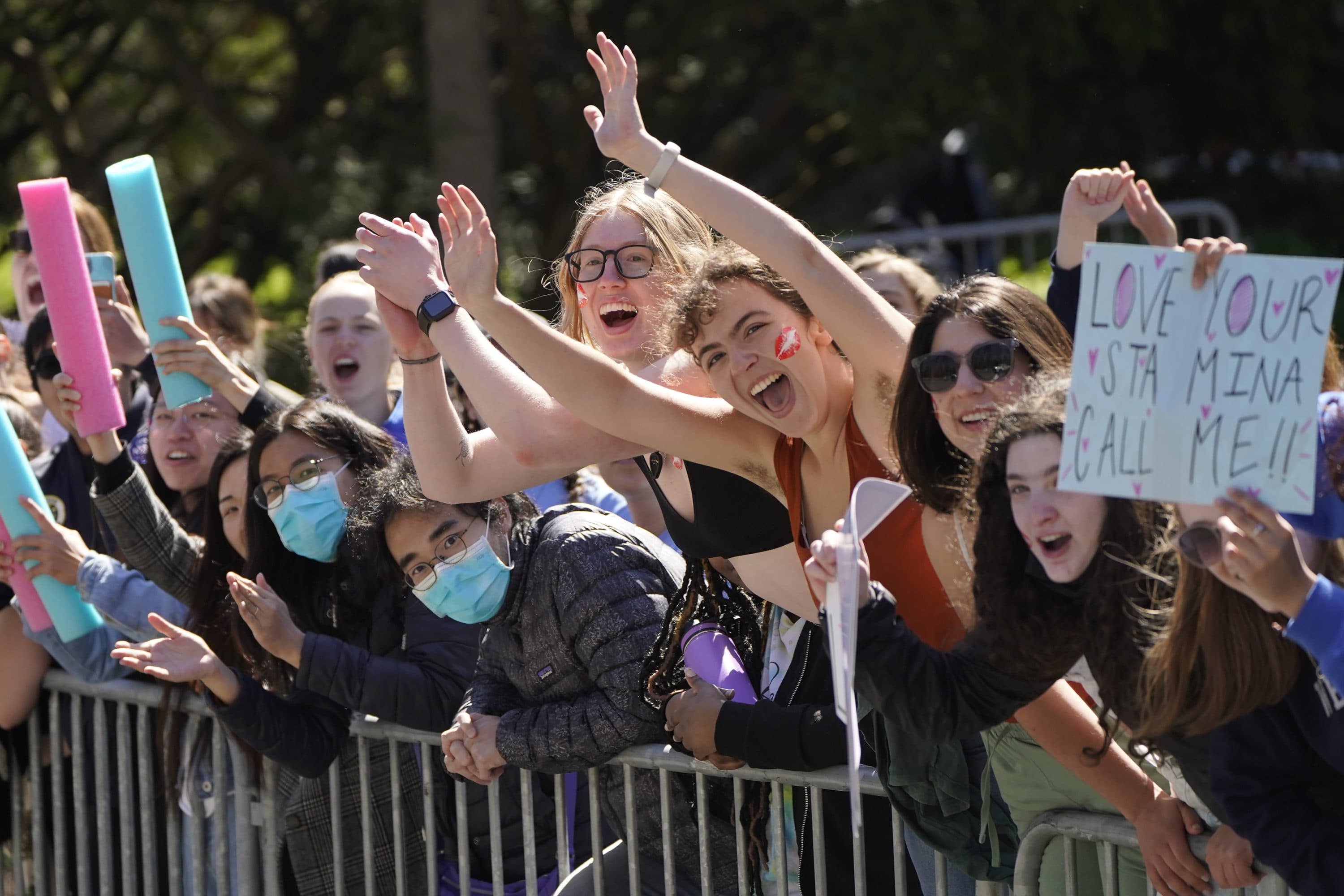 People cheer in front of Wellesley College as runners pass during the 126th Boston Marathon. (Steven Senne/AP)
