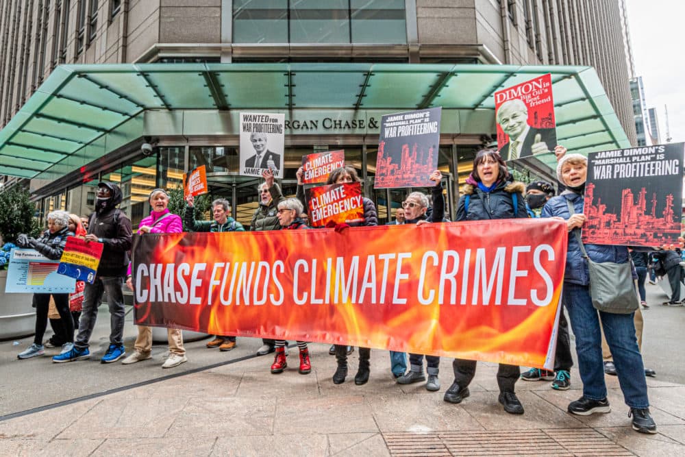 As part of Earth Week, Rise and Resist climate activists held a peaceful protest at JPMorgan Chase headquarters world headquarters in Manhattan to protest CEO Jamie Dimon's &quot;Marshall Plan&quot; which will aggressively increment fossil fuel production, and boost Chase profits, increasing carbon emissions worldwide. (Photo by Erik McGregor/LightRocket via Getty Images)