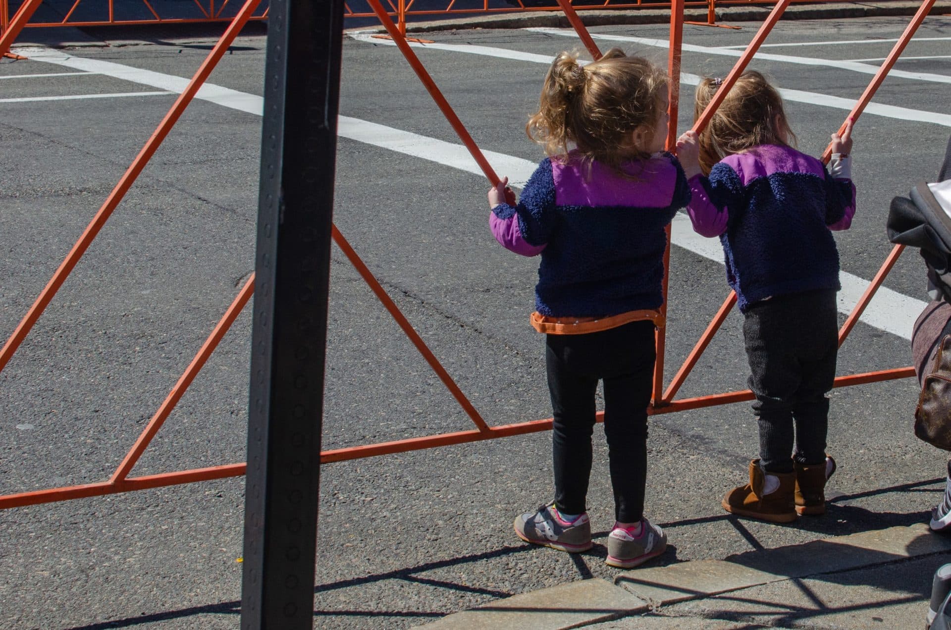 Children eagerly await Marathon racers on Beacon Street in Brookline. (Sharon Brody/WBUR)