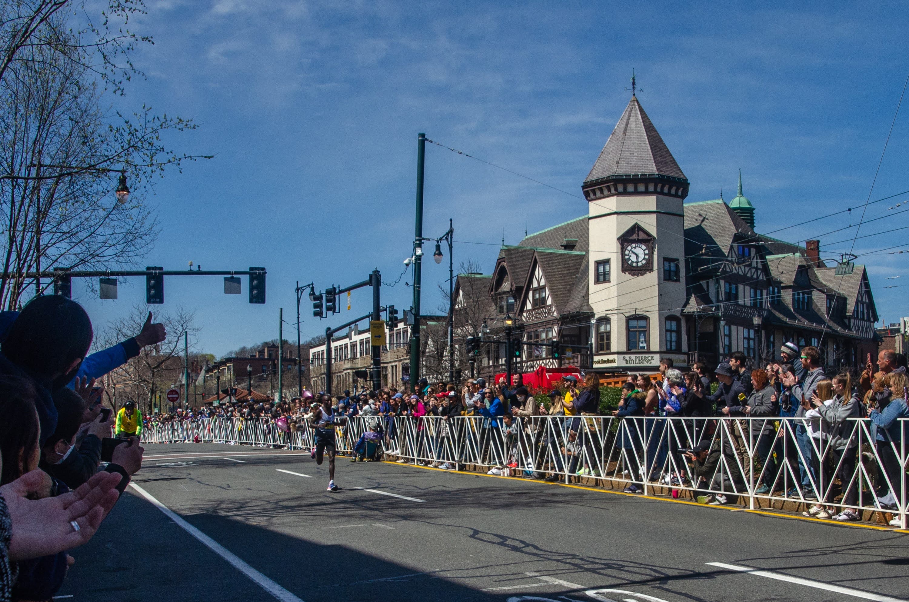 Evans Chebet of Kenya at Coolidge Corner, on his way to victory. (Sharon Brody/WBUR)