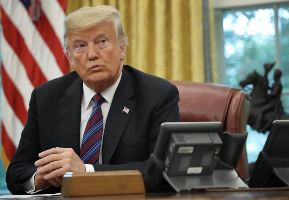 President Donald Trump speaks on the telephone via speakerphone with Mexican President Enrique Pena Nieto in the Oval Office of the White House on August 27, 2018 in Washington, DC. (Win McNamee/Getty Images)