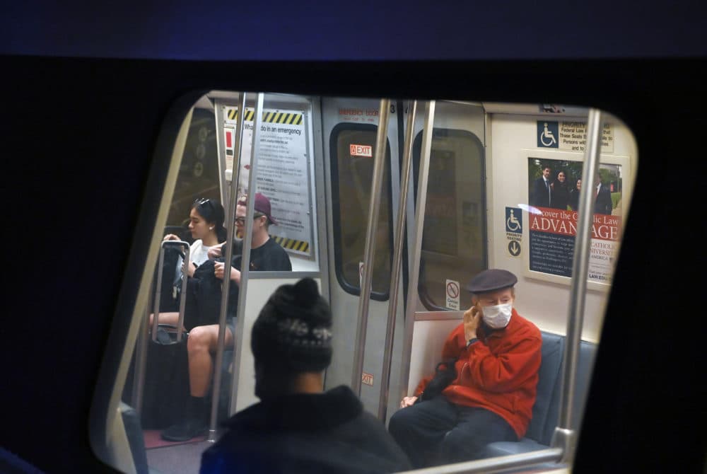 Riders with and without masks ride a train at Metro Center Station on Tuesday April 19, 2022 in Washington, DC. Metro has lifted the mask mandate for riders. (Matt McClain/The Washington Post via Getty Images)