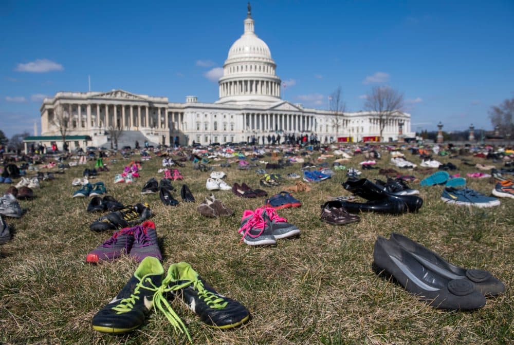 The lawn outside the U.S. Capitol is covered with 7,000 pairs of empty shoes to memorialize the 7,000 children killed by gun violence since the Sandy Hook school shooting, in a display organized by the global advocacy group Avaaz, in Washington, DC, March 13, 2018. (Saul Loeb/AFP via Getty Images)