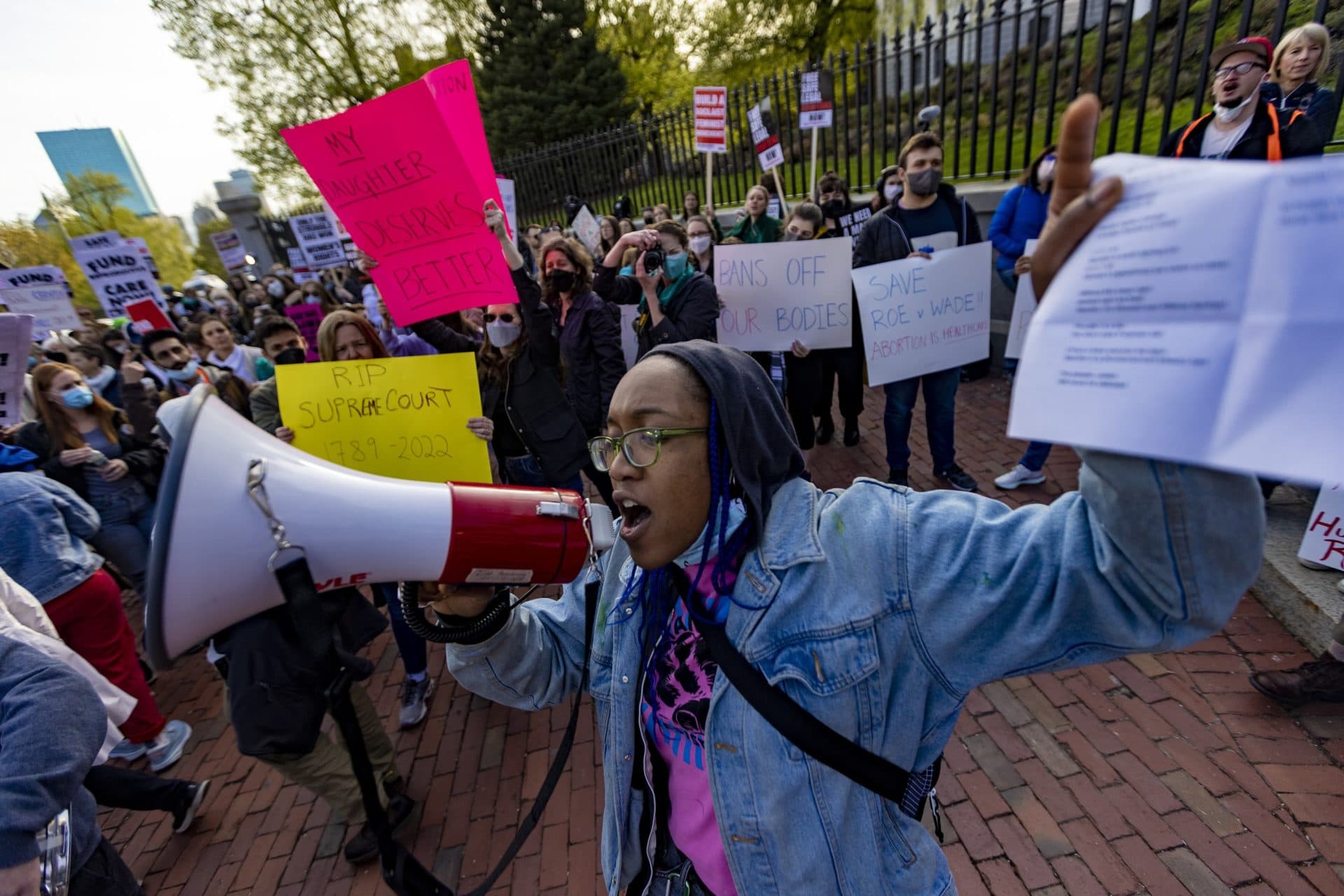 Naph (no last name) chants to the crowd of thousands that gathered at the Massachusetts State House for the Defend Abortion Rights rally. (Jesse Costa/WBUR)