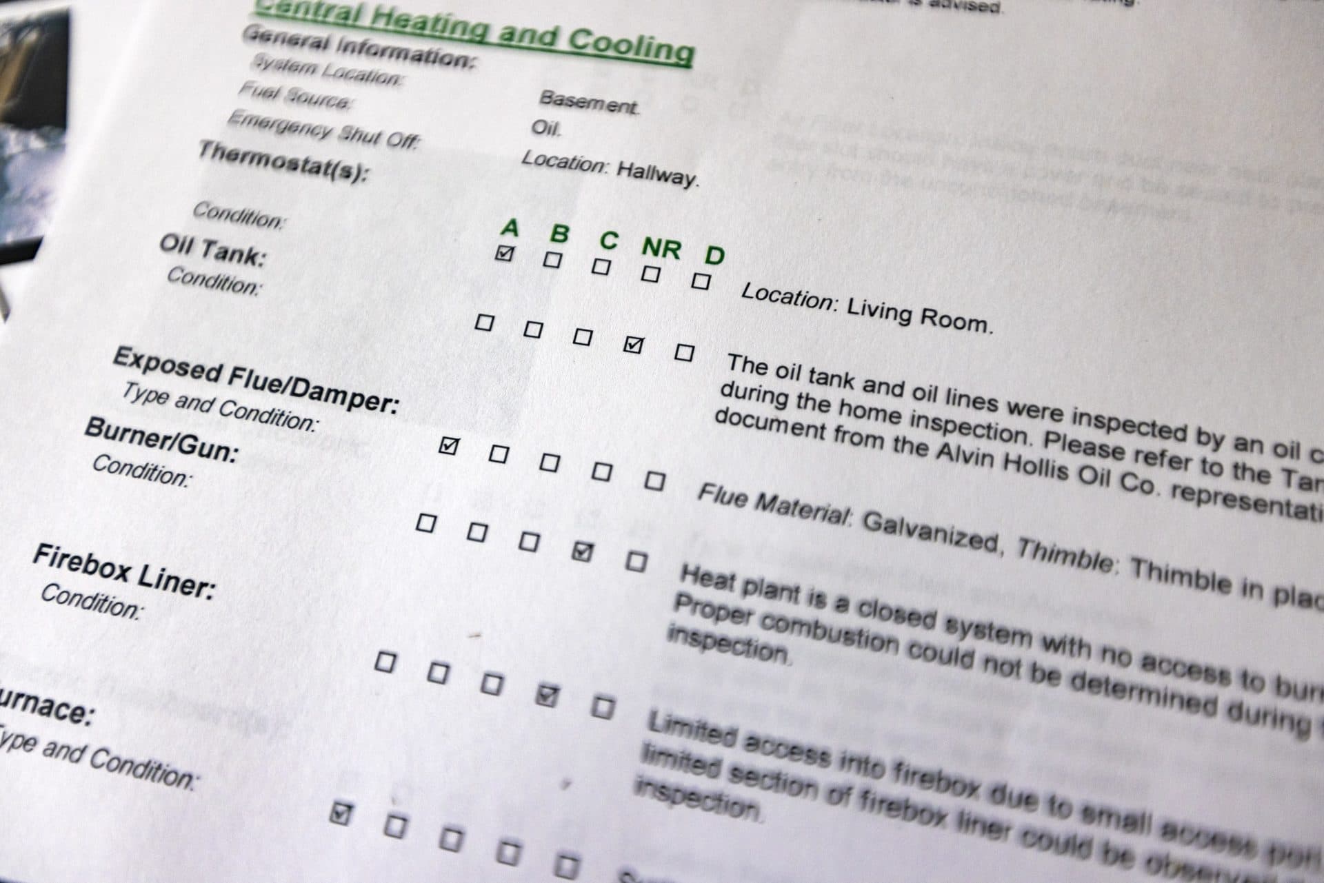 Each report produced by Tiger Home Inspection contains a checklist of items inspected and graded. (Jesse Costa/WBUR)
