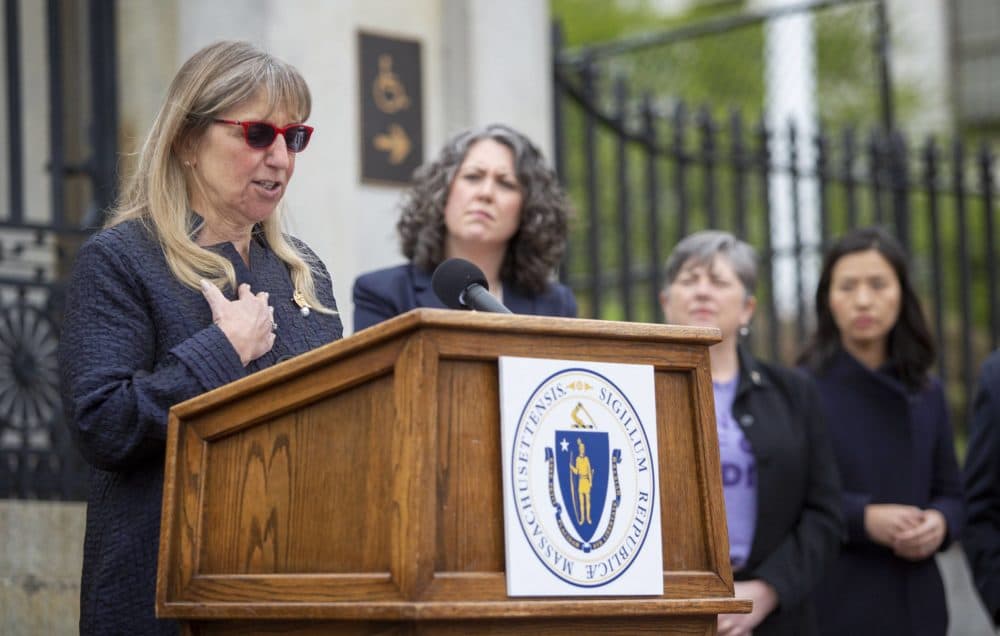 Senate President Karen Spilka talks to the press on the State House steps. (Robin Lubbock/WBUR)