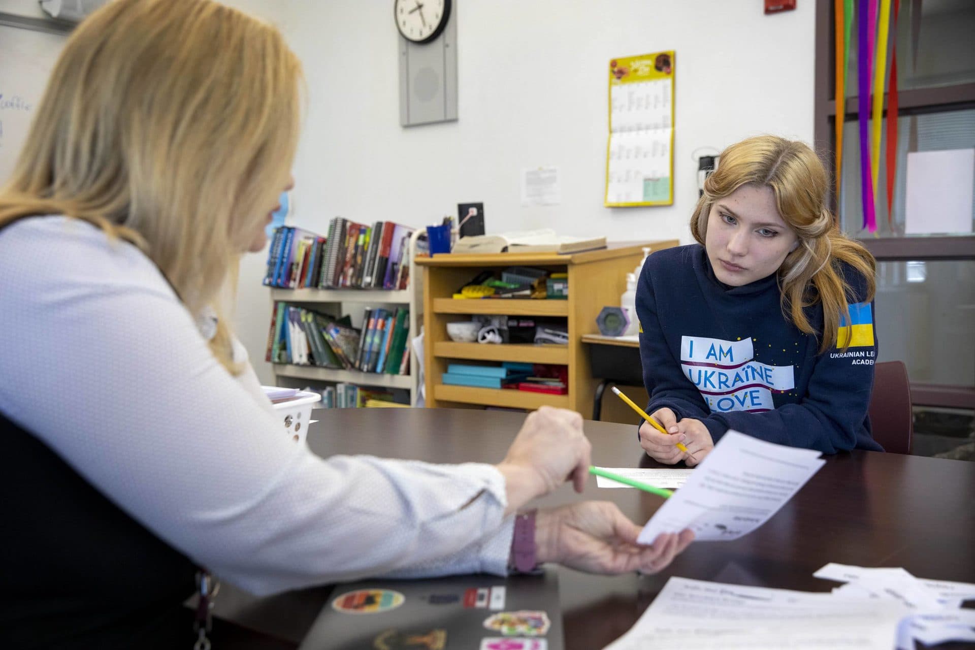 Pokliatska works with teacher Corrina Kerr in English learners class at Sharon High School. (Robin Lubbock/WBUR)