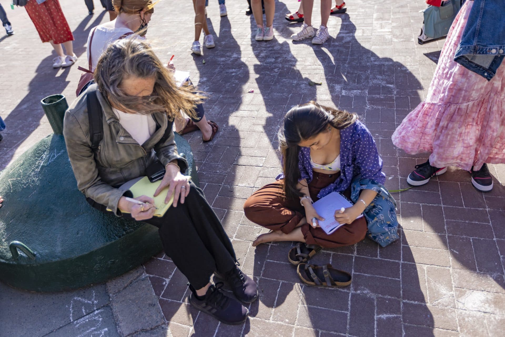 Composition books and legal pads were passed out to people to write down their thoughts. (Jesse Costa/WBUR)