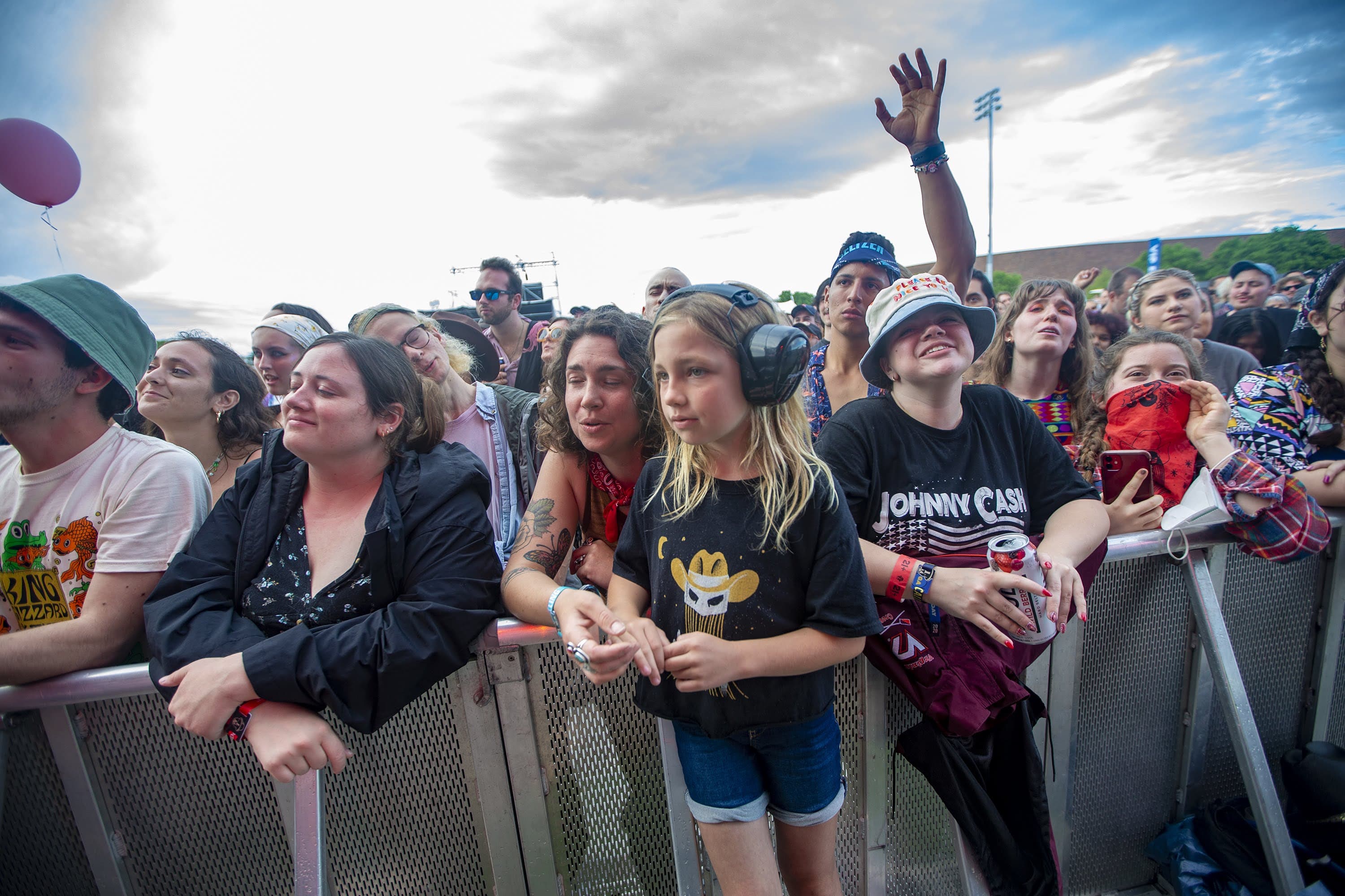 Members of the audience sing along with Orville Peck during his performance. (Jesse Costa/WBUR)