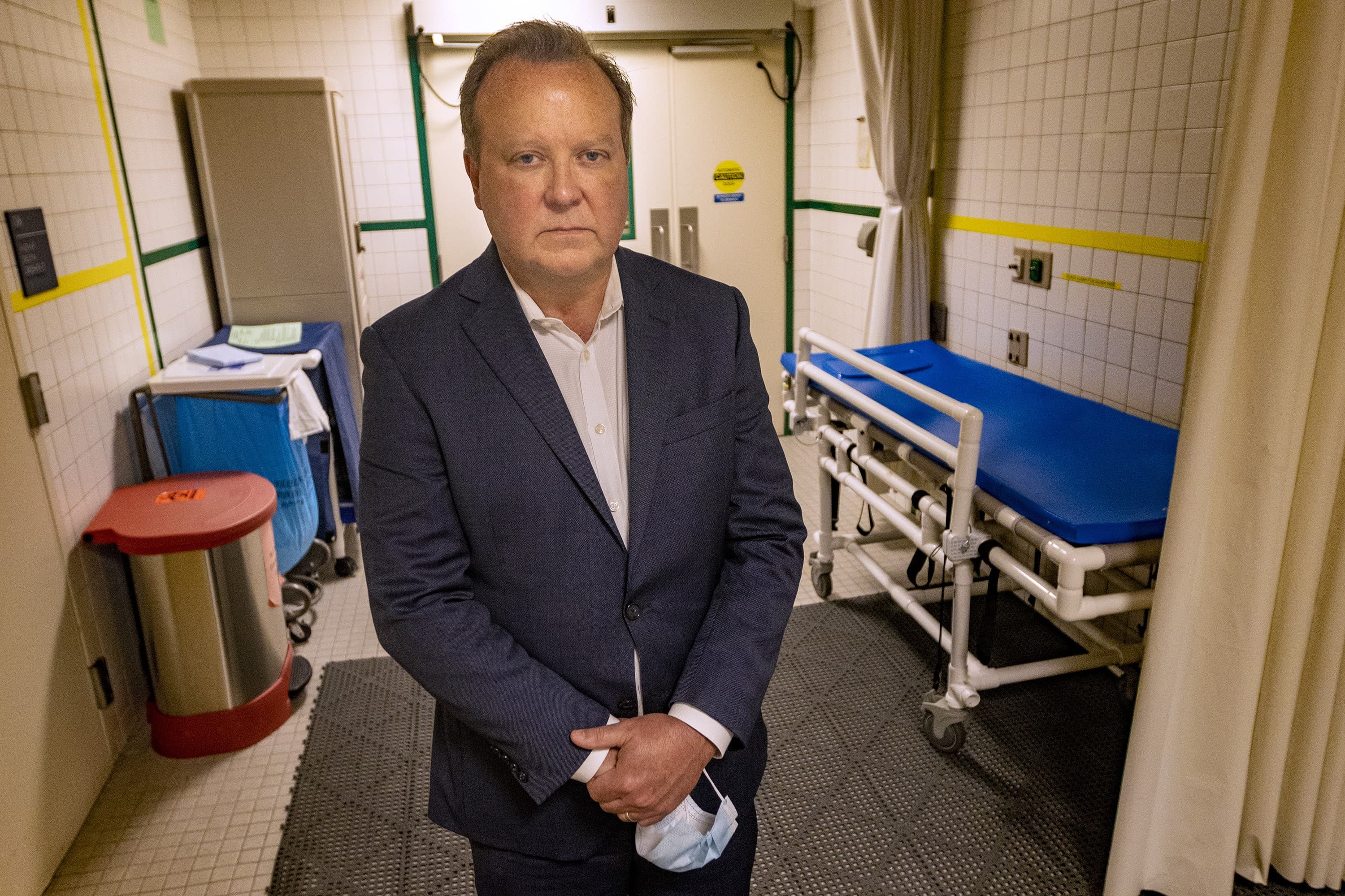 Dr. Paul Biddinger, chief preparedness and continuity officer for the Mass General Brigham health system, standing in the emergency department at Massachusetts General Hospital. (Jesse Costa/WBUR)