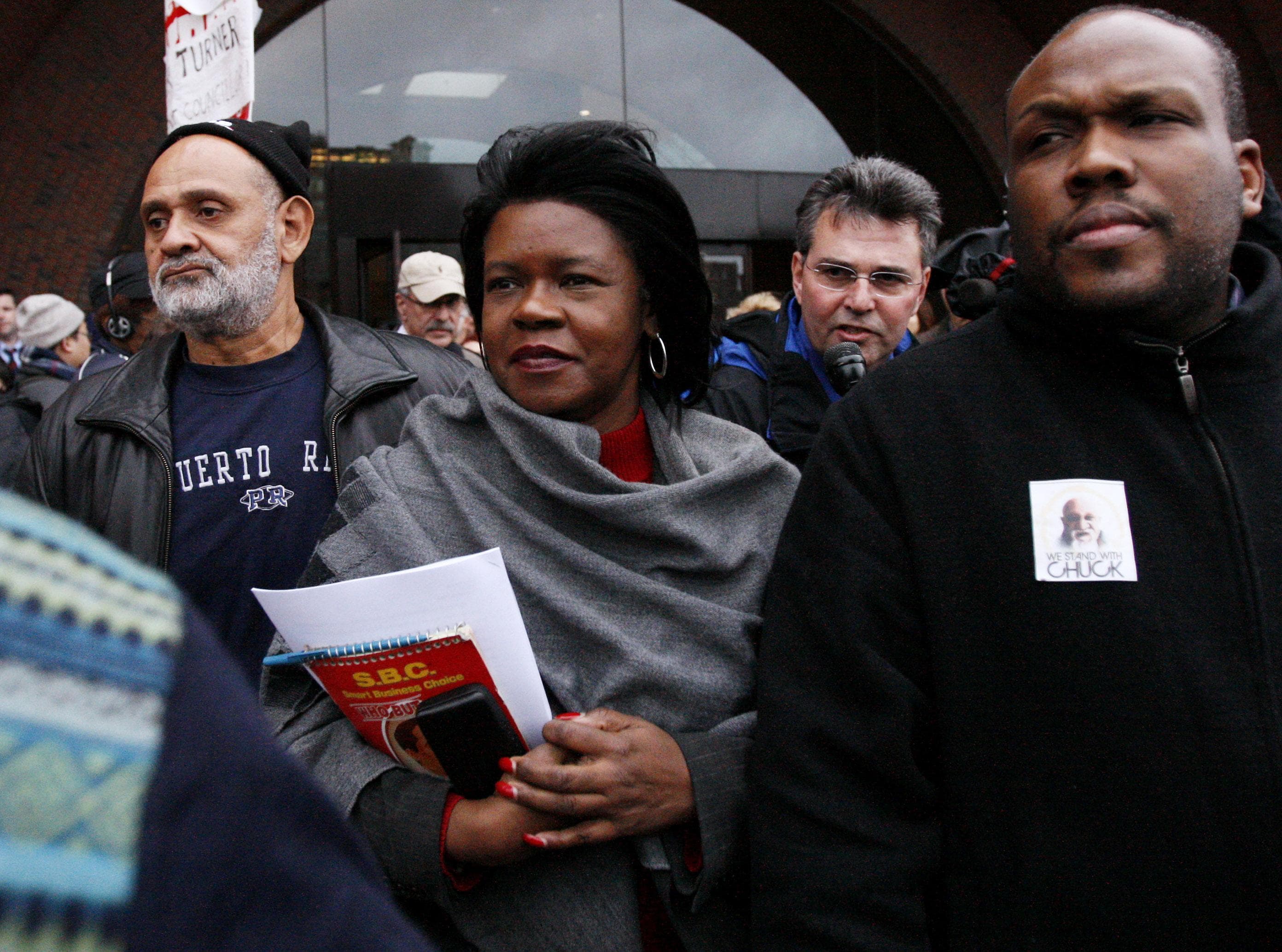 Former Massachusetts state Sen. Dianne Wilkerson, center, leaves federal court in Boston Wednesday, Dec. 10, 2008. (Winslow Townson/AP)