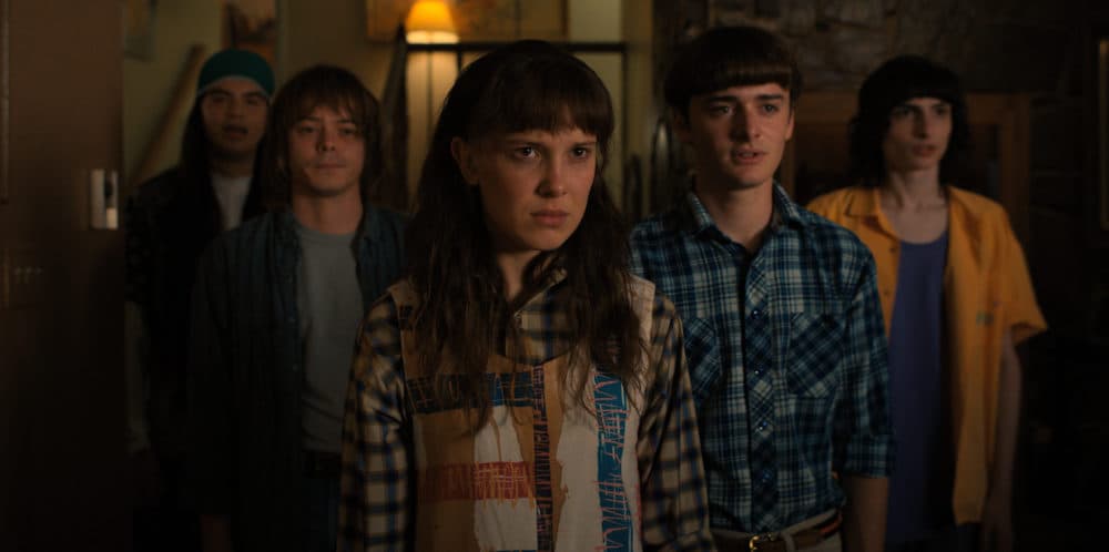 From left to right, Eduardo Franco as Argyle, Charlie Heaton as Jonathan, Millie Bobby Brown as Eleven, Noah Schnapp as Will Byers, and Finn Wolfhard as Mike Wheeler in &quot;Stranger Things.&quot; (Courtesy of Netflix © 2022)