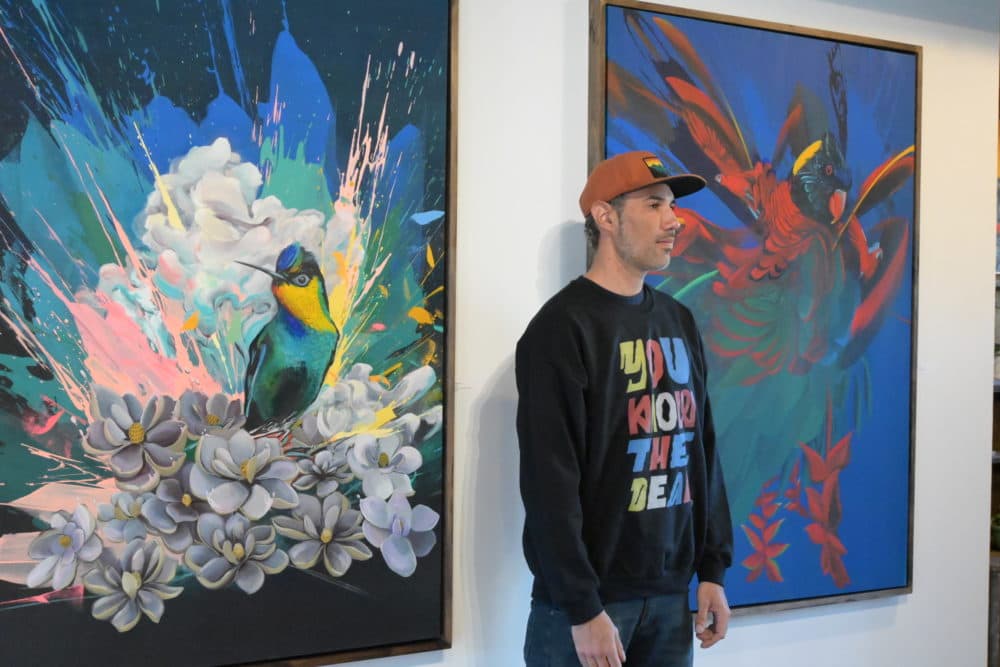 Ortiz stands beside his work at Rugosa Gallery in Eastham. (Courtesy Magnolia Rios)