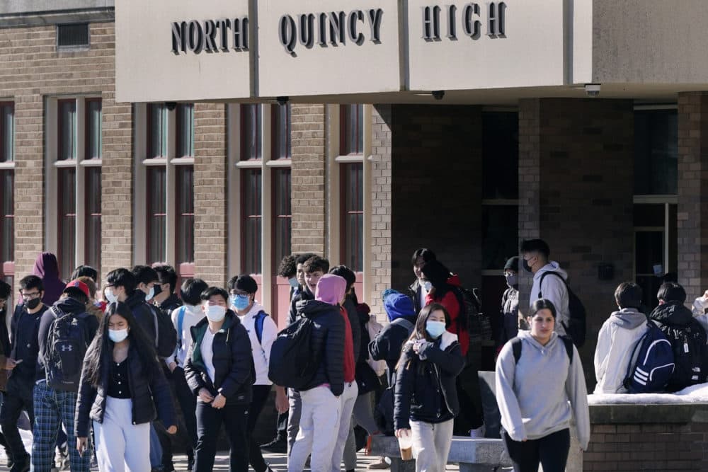 Students walk from North Quincy High School at the end of the school day on Feb. 28, 2022. (Charles Krupa/AP)