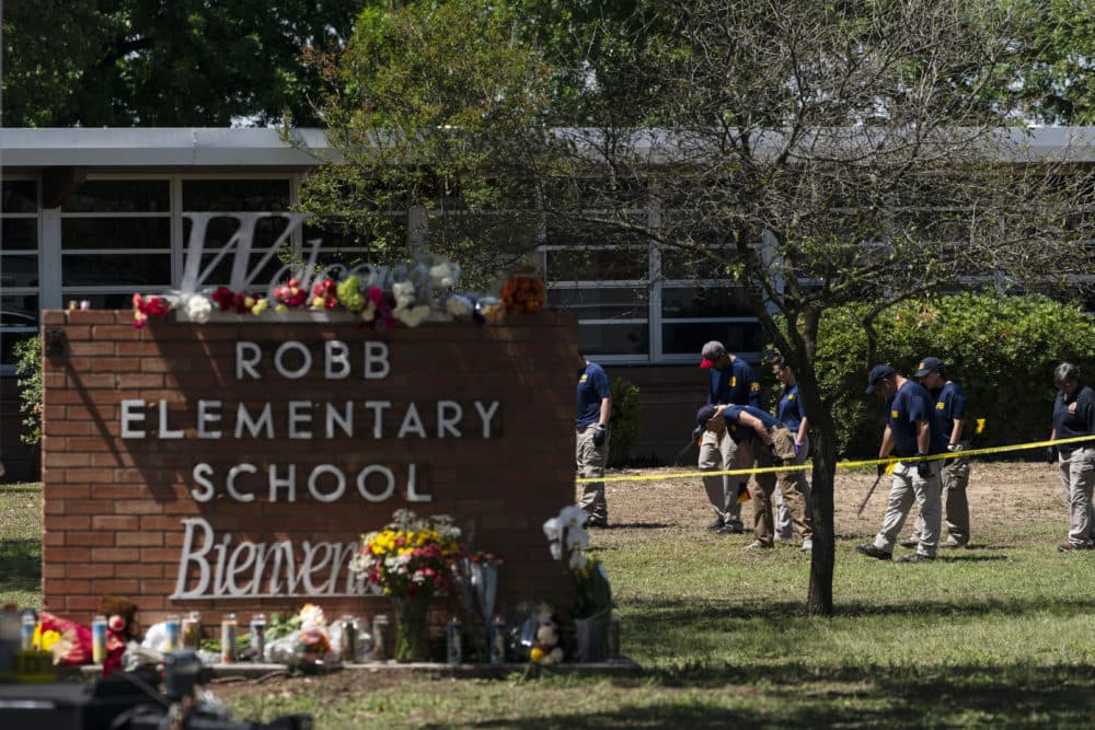 Investigators search for evidences outside Robb Elementary School in Uvalde, Texas, Wednesday, May 25, 2022. Desperation turned to heart-wrenching sorrow for families of grade schoolers killed after an 18-year-old gunman barricaded himself in their Texas classroom and began shooting, killing several fourth-graders and their teachers. (Jae C. Hong/AP)