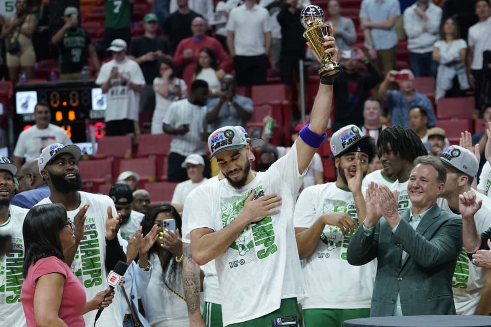 Boston Celtics forward Jayson Tatum raises the NBA Eastern Conference MVP trophy after defeating the Miami Heat in Game 7 of the NBA basketball Eastern Conference finals playoff series on Sunday, May 29, in Miami. (Lynne Sladky/AP)