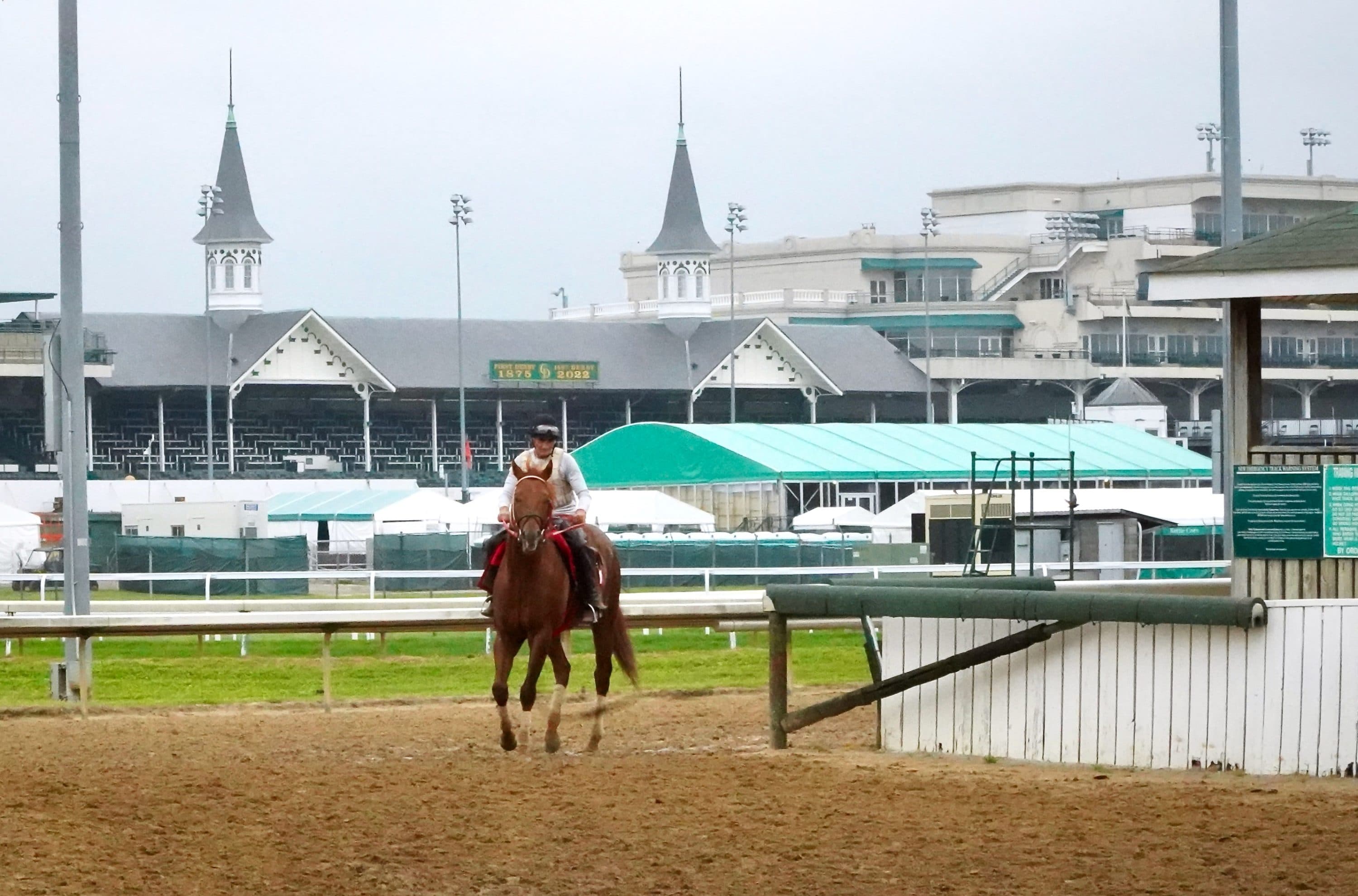 A horse and jockey head back toward the stables at Churchill Down. (Stephanie Wolf/WFPL News)