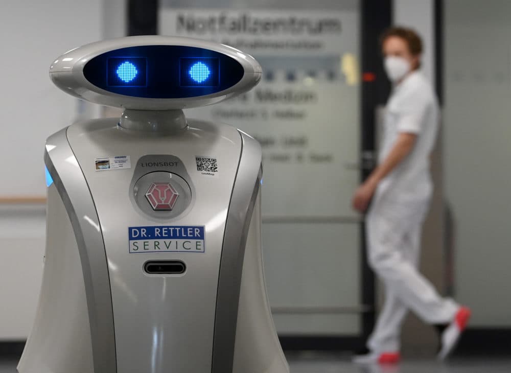 Cleaning robot 'Franzi' cleans in the entrance area of a hospital in Munich Neuperlach, southern Germany, on February 12, 2021. (CHRISTOF STACHE/AFP via Getty Images)