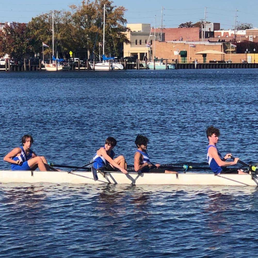 Vinoj Fullen rowing with his team. (Courtesy)