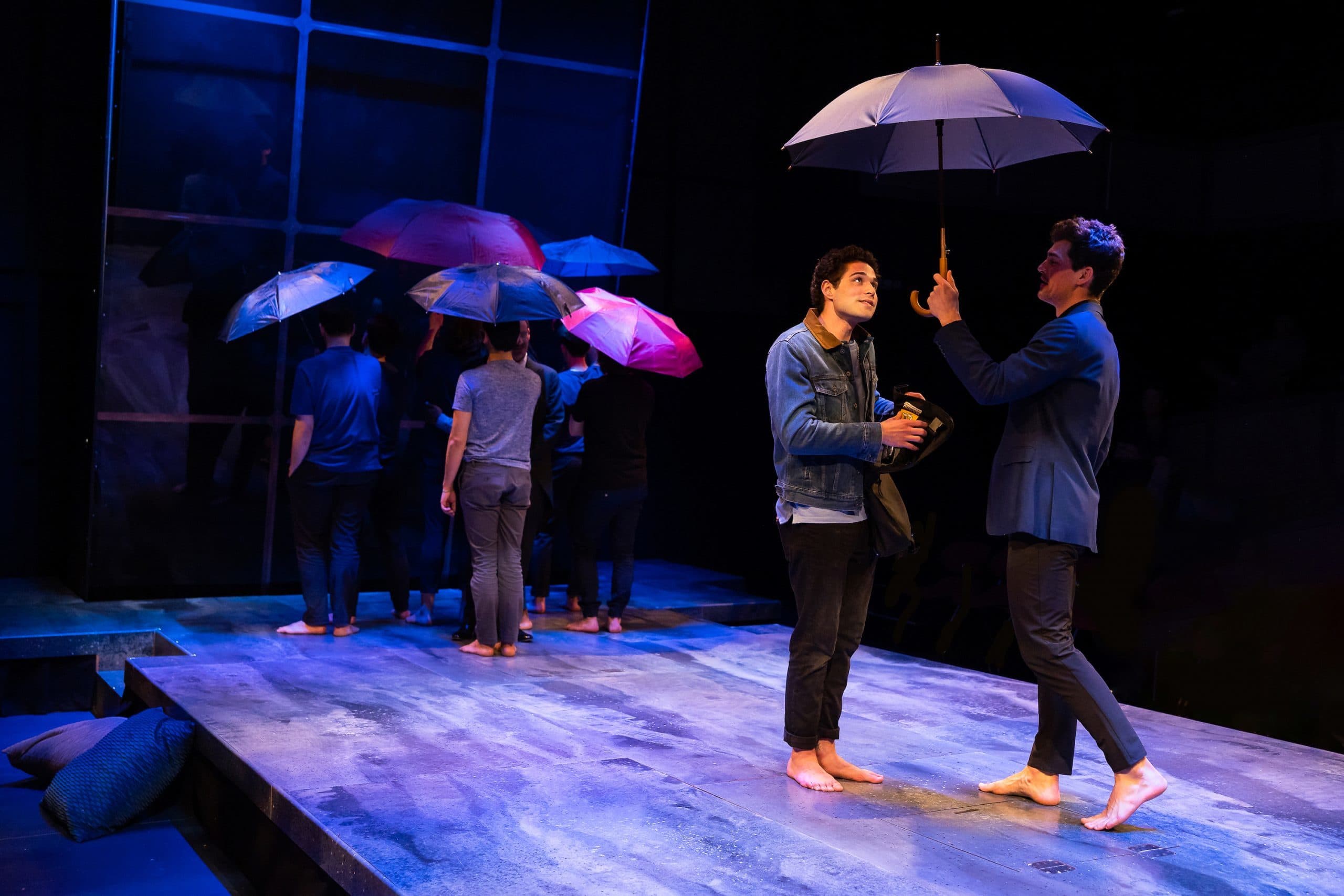Mishka Yarovoy (center), Jared Reinfeldt (right) and members of the cast of SpeakEasy Stage Company’s "The Inheritance." (Courtesy Nile Scott Studios)