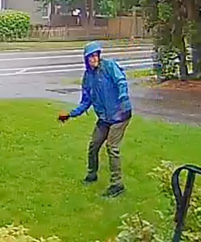 On Thursday, the Middlesex County District Attorney released this surveillance photo of a man throwing a brick at a reporter's home in Melrose, Mass. (Courtesy Middlesex County District Attorney's Offiice)