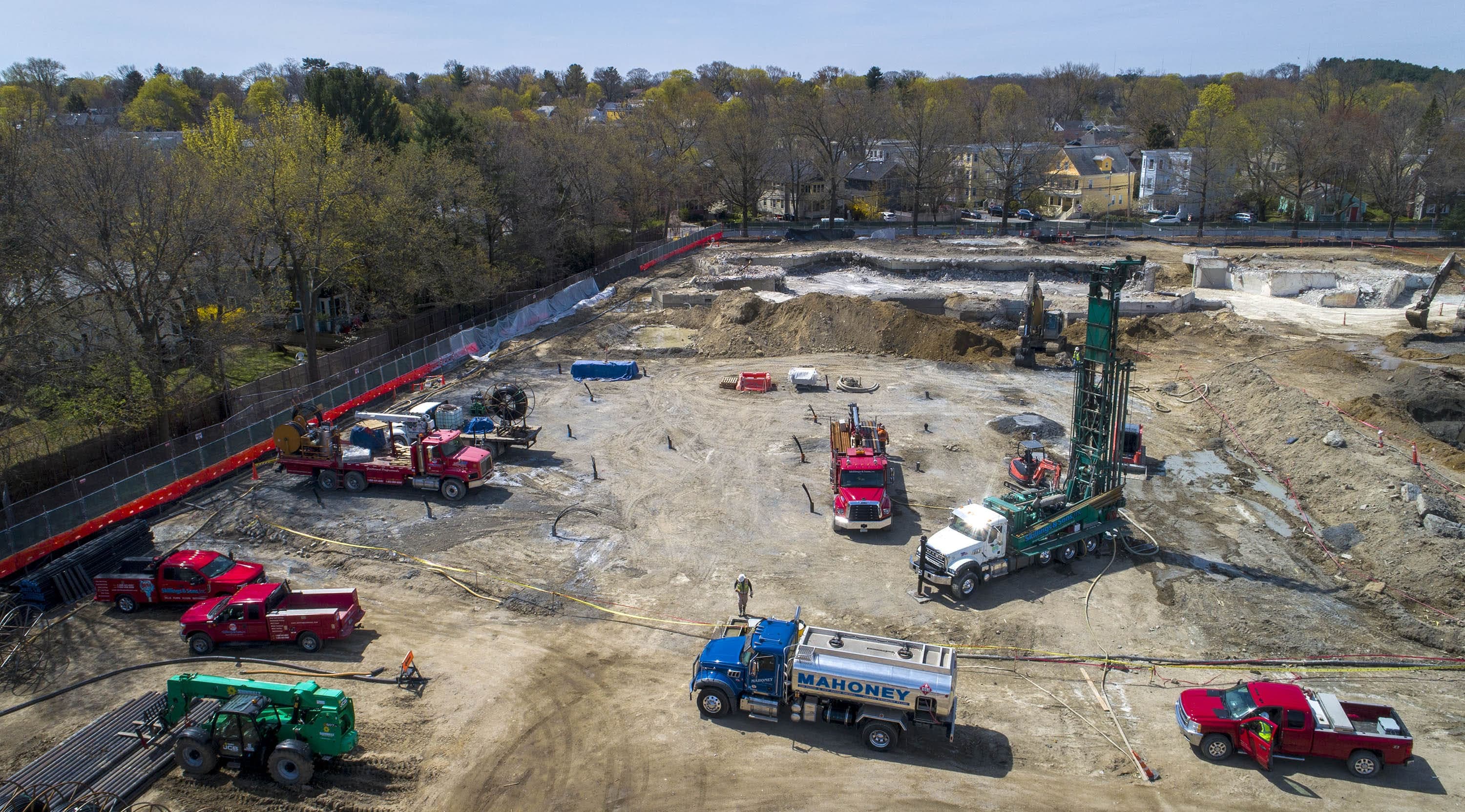 A drilling crew drills a vertical system of geothermal wells on the site of the new Vassal Lane School in Cambridge. (Robin Lubbock/WBUR)