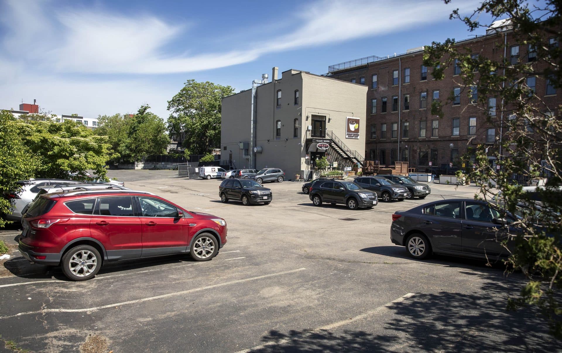 The parking lot at 2147 Washington Street where the new 6-story mixed-use passive house building will be developed. (Robin Lubbock/WBUR)