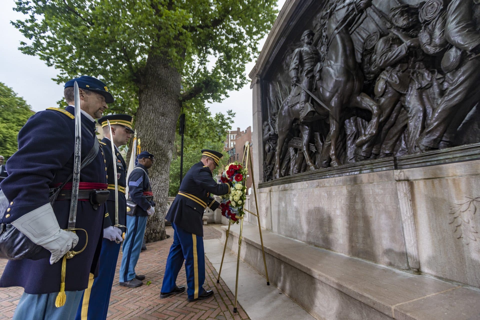 A wreath is placed in front of the Robert Gould Shaw and the 54th Regiment Memorial during the rededication ceremony. (Jesse Costa/WBUR)