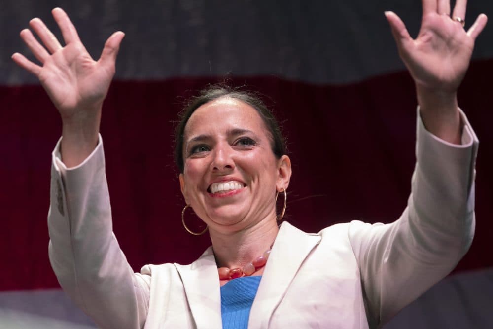 Massachusetts state Sen., and candidate for governor, Sonia Chang-Díaz waves as she takes the stage to address delegates at the state's Democratic party convention. (Michael Dwyer/AP)