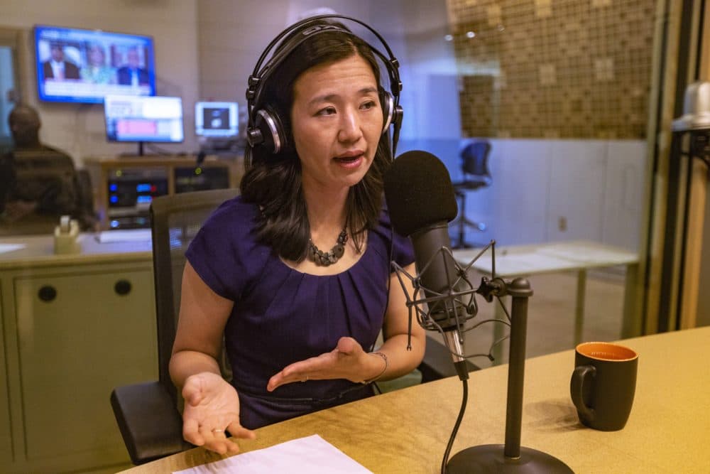 Mayor Michelle Wu speaking on the air with host Tiziana Dearing on Radio Boston. (Jesse Costa/WBUR)