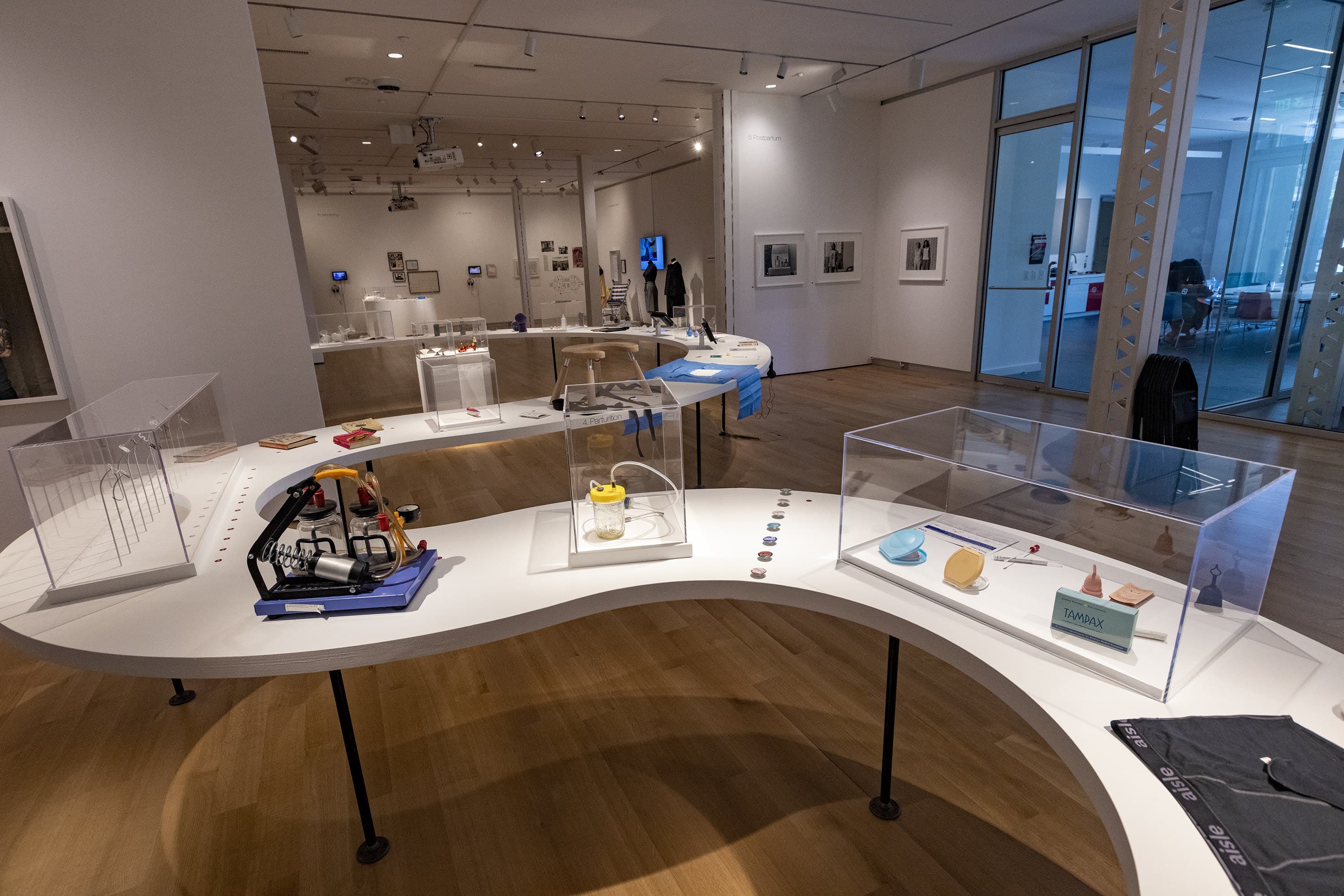 An installation view of the exhibition "Designing Motherhood" at the MassArt Art Museum. (Jesse Costa/WBUR)