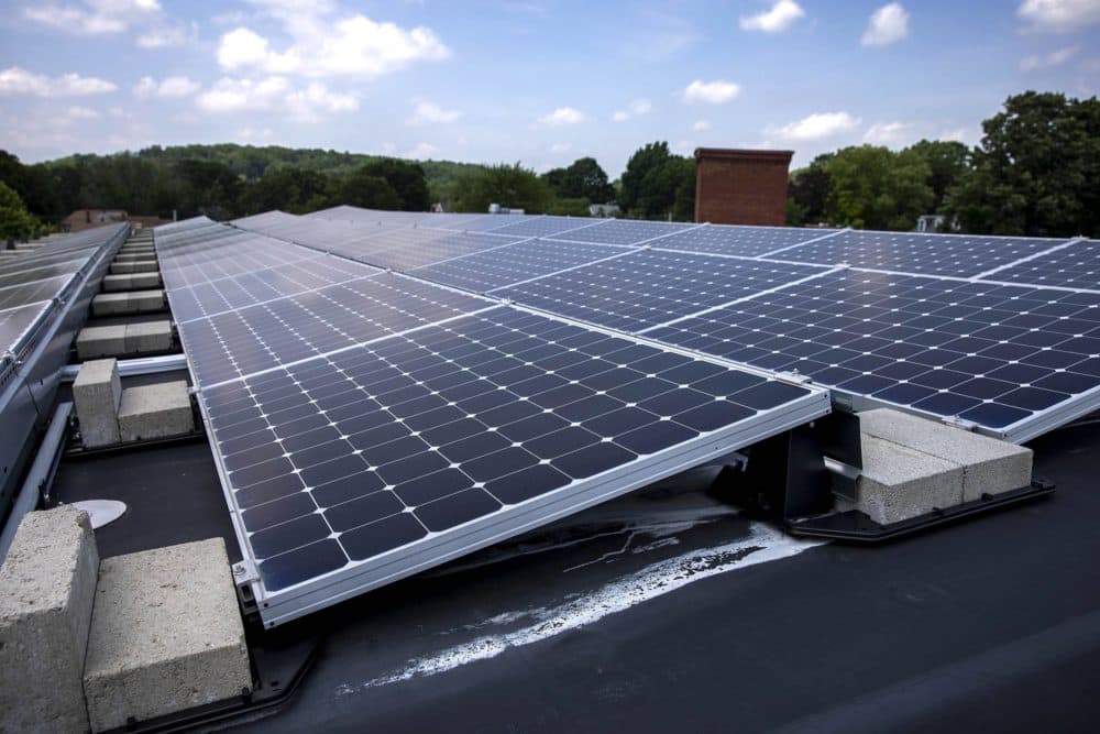 Solar panels on the roof of a building in Amesbury. (Robin Lubbock/WBUR)