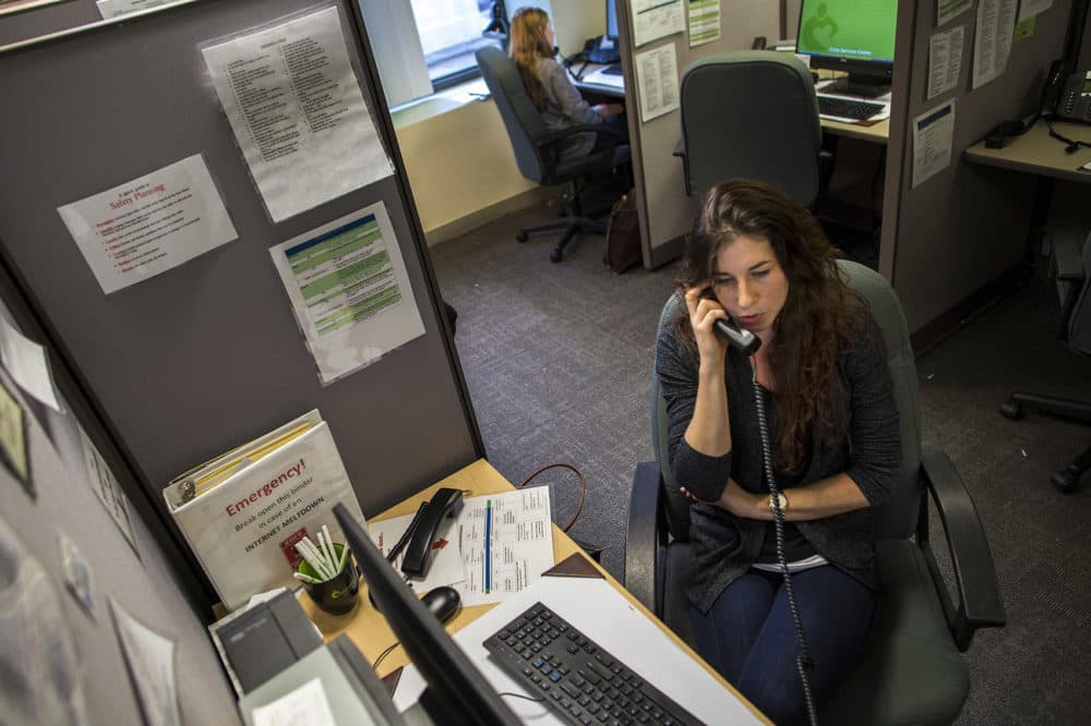 In this WBUR file photo, a volunteer speaks with a caller on the Samaritans hotline. (Jesse Costa/WBUR)