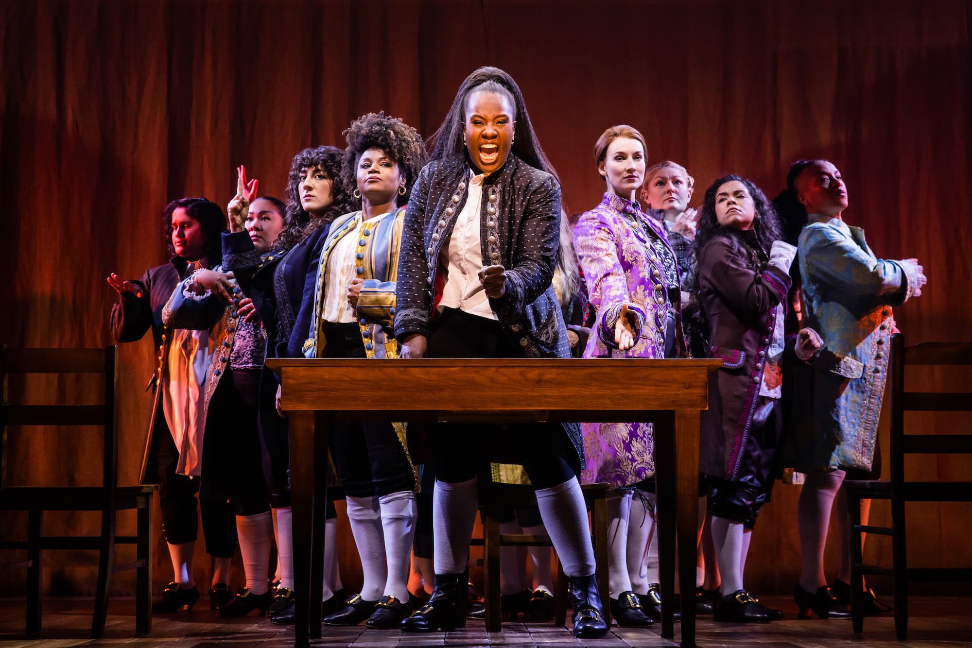 Crystal Lucas-Perry, playing John Adams, and the cast of &quot;1776&quot; at the American Repertory Theater. (Courtesy Evan Zimmerman for Murphy Made)