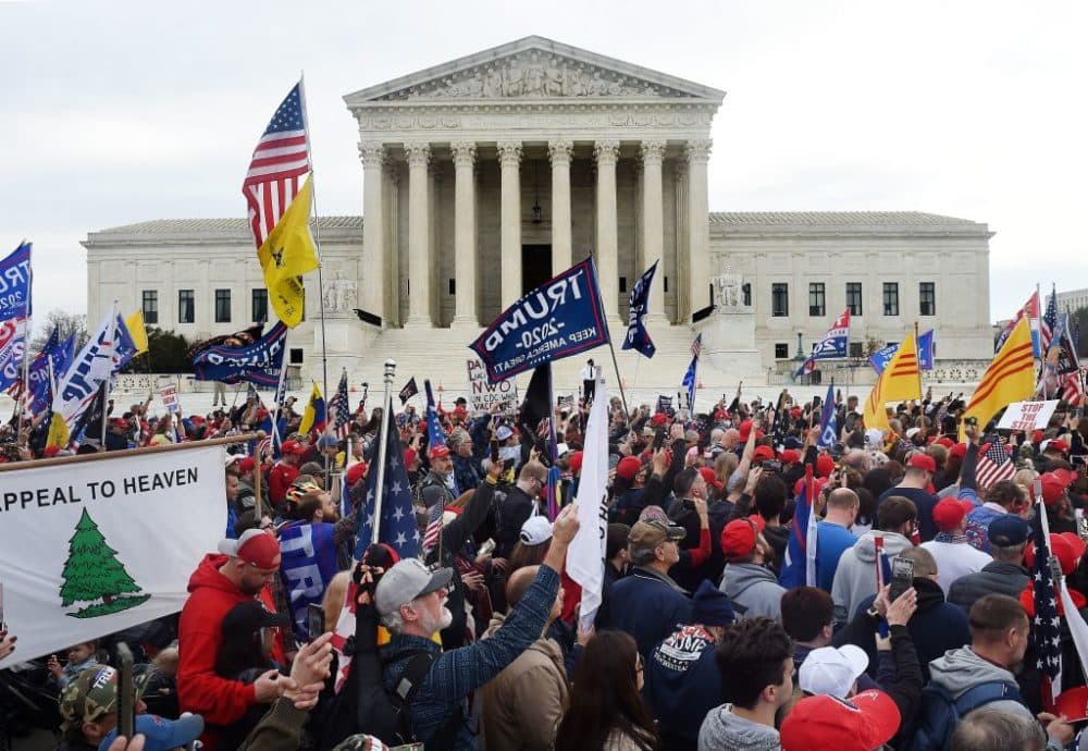 Supporters of President Donald Trump participate in the Million MAGA March  to protest the outcome of the 2020 presidential election, in front of the US Supreme Court on December 12, 2020 in Washington, DC. (Photo by Olivier Douliery / AFP via Getty Images)