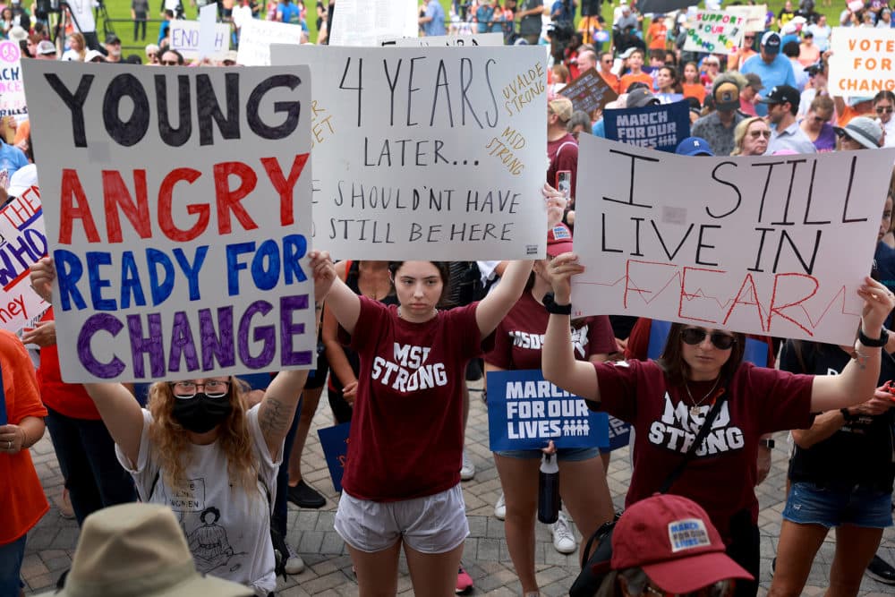 (L-R) Lauren Klein, Taylor Bensin, and Stephanie Horowitz join with others during the second March for Our Lives rally against gun violence at Pine Trails Park on June 11, 2022 in Parkland, Florida. Community members from Parkland and all of South Florida joined together for the March For Our Lives Parkland rally near Marjory Stoneman Douglas High School, where 17 people were killed by a gunman on February 14, 2018. (Joe Raedle / Getty Images)