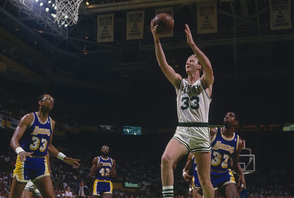 Larry Bird #33 of the Boston Celtics goes for a layup as Kareem Abdul-Jabbar #33 and Magic Johnson #32 of the Los Angeles Lakers watch Bird's shot during during the 1987 NBA Championships at The Boston Garden in Boston, Massachusetts. (Focus on Sport via Getty Images)