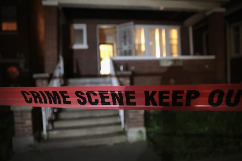 Crime scene tape is stretched around the front of a home where a man was shot in Chicago, Illinois. (Scott Olson/Getty Images)