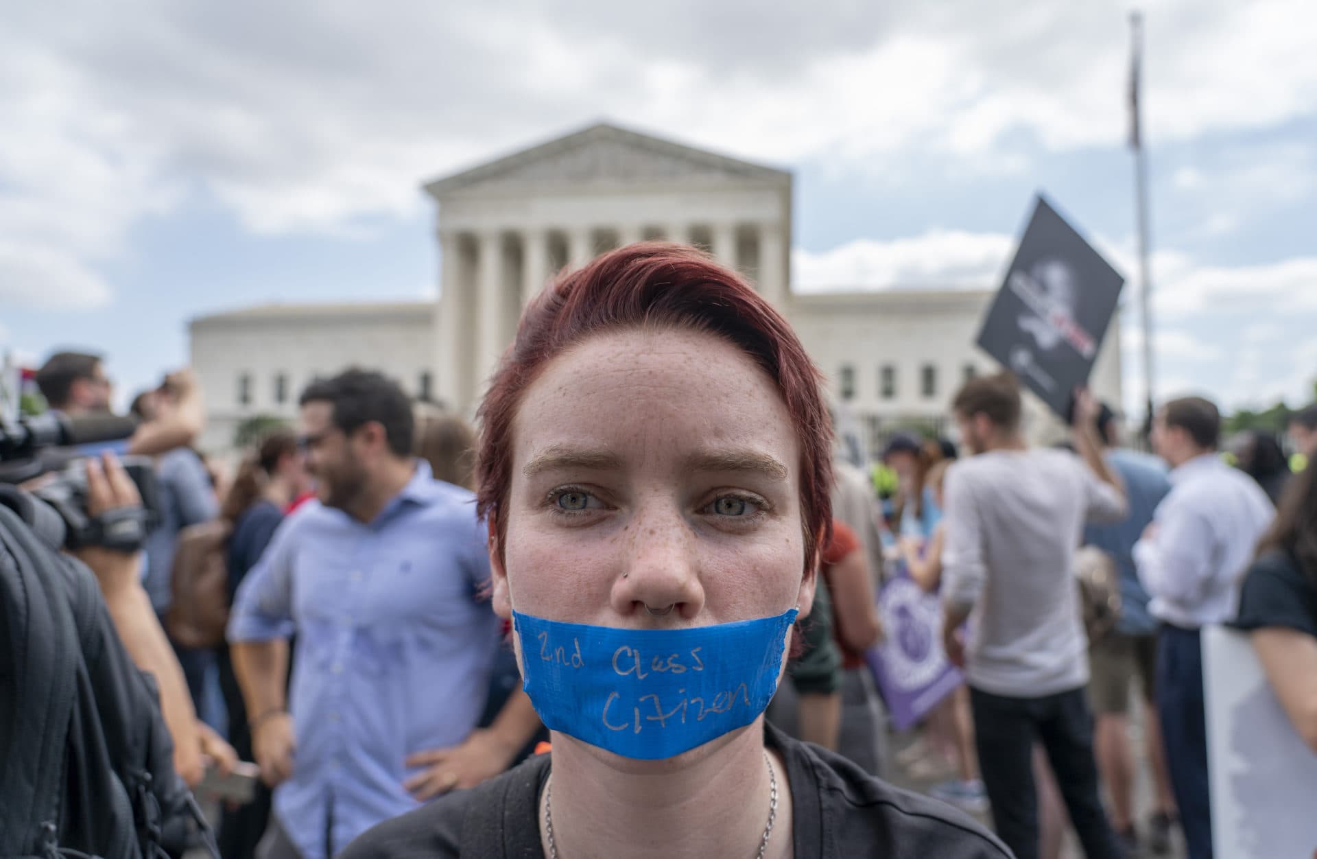 An abortion-rights protester with tape over their mouth that reads &quot;2nd Class Citizen.&quot; (Gemunu Amarasinghe/AP)