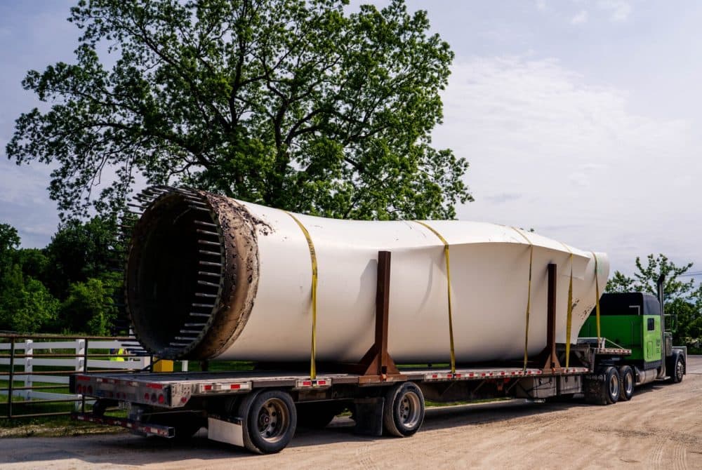 A deconstructed wind turbine blade sits on a tractor-trailer after it is weighed on Monday at Veolia Environmental Services in Louisiana, Missouri. The company has expanded the plant's services in order to recycle the blades from across the United States. (Brian Munoz/St. Louis Public Radio)