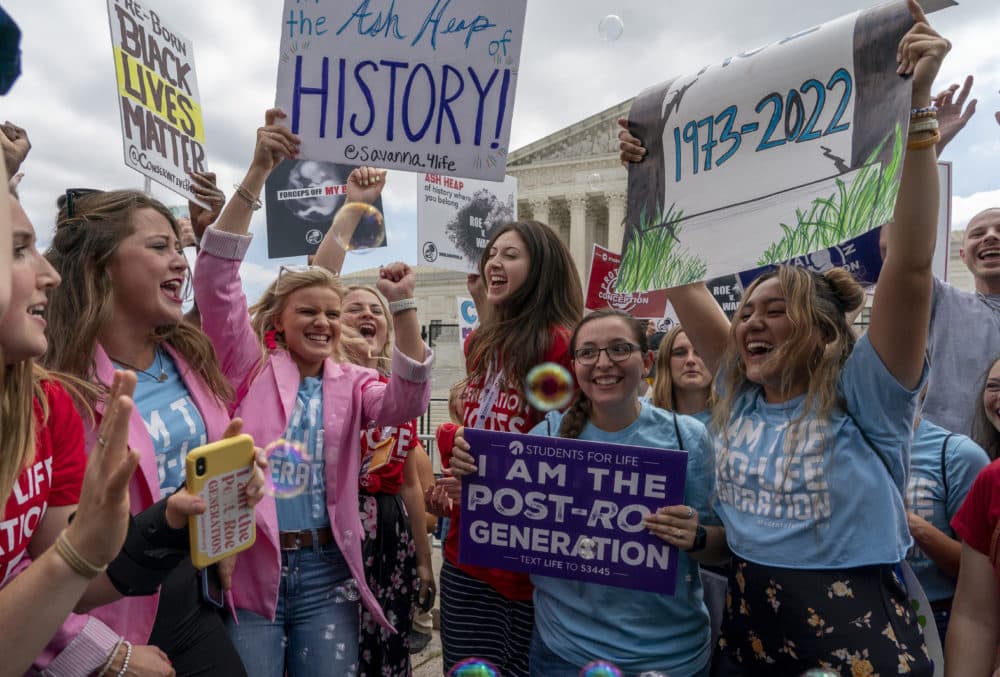 Anti-abortion protesters celebrate following Supreme Court's decision to overturn Roe v. Wade on June 24. (Gemunu Amarasinghe/AP)