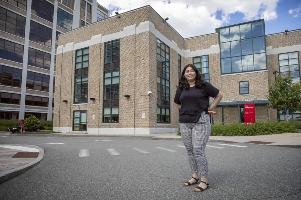 Kathryn Roldan stands near Bright Horizons, where she worked while studying for her high school diploma at Chelsea Opportunity Academy. (Robin Lubbock/WBUR)