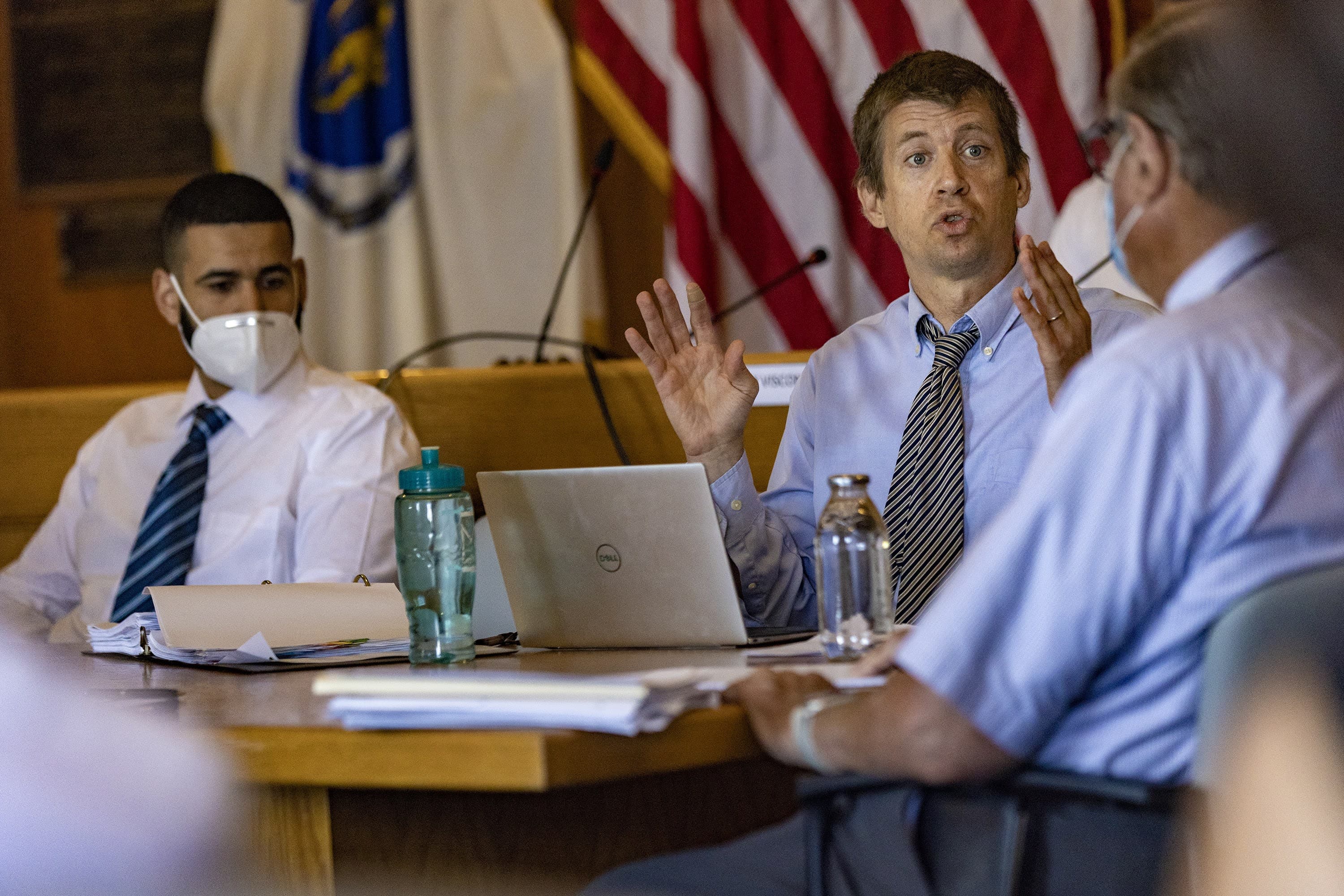 Patrick Bryan, a labor attorney representing the Revere Police Patrol Officers Association, speaks while Youness Elalam, left, listens at his arbitration hearing inside Revere City Hall. (Jesse Costa/WBUR)