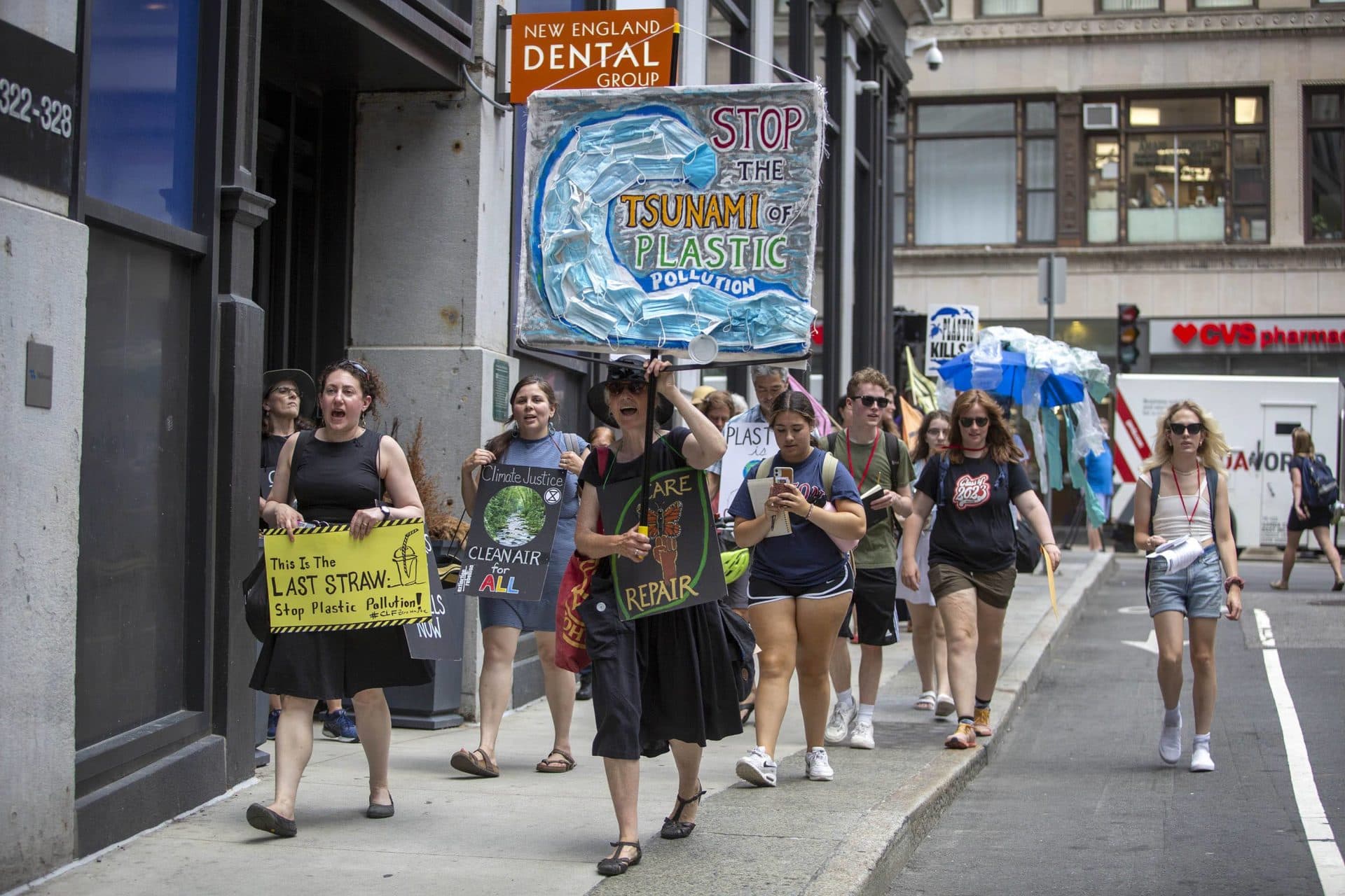 Beyond Plastics demonstrators march through downtown Boston. (Robin Lubbock/WBUR)