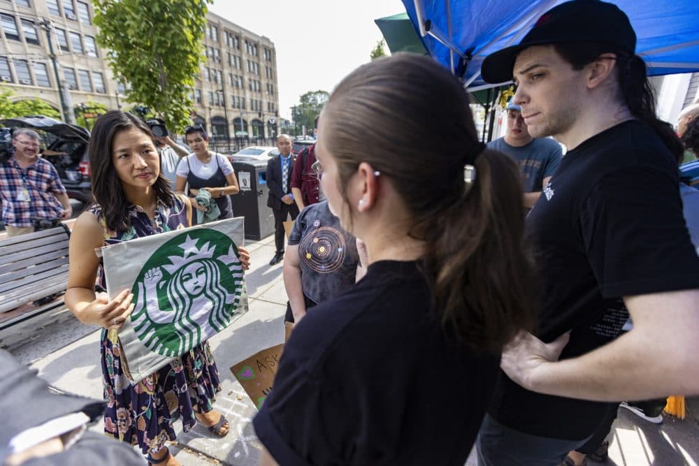 Mayor Michelle Wu meets with striking workers at the Starbucks at 874 Commonwealth Avenue on July 25, 2022. (Jesse Costa/WBUR)