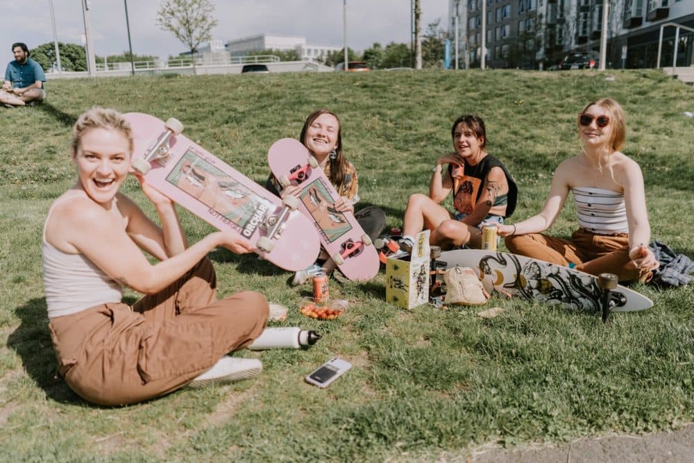 The members of Lonely Bones showing off their decks.  (Courtesy of Becca Brichacek/Lonely Bones)