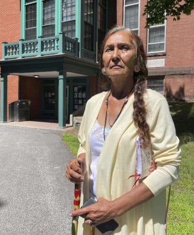 Leola One Feather, of the Oglala Sioux Tribe in South Dakota, stands outside the Woods Memorial Library in Barre, which houses the Founders Museum. (Philip Marcelo/AP)