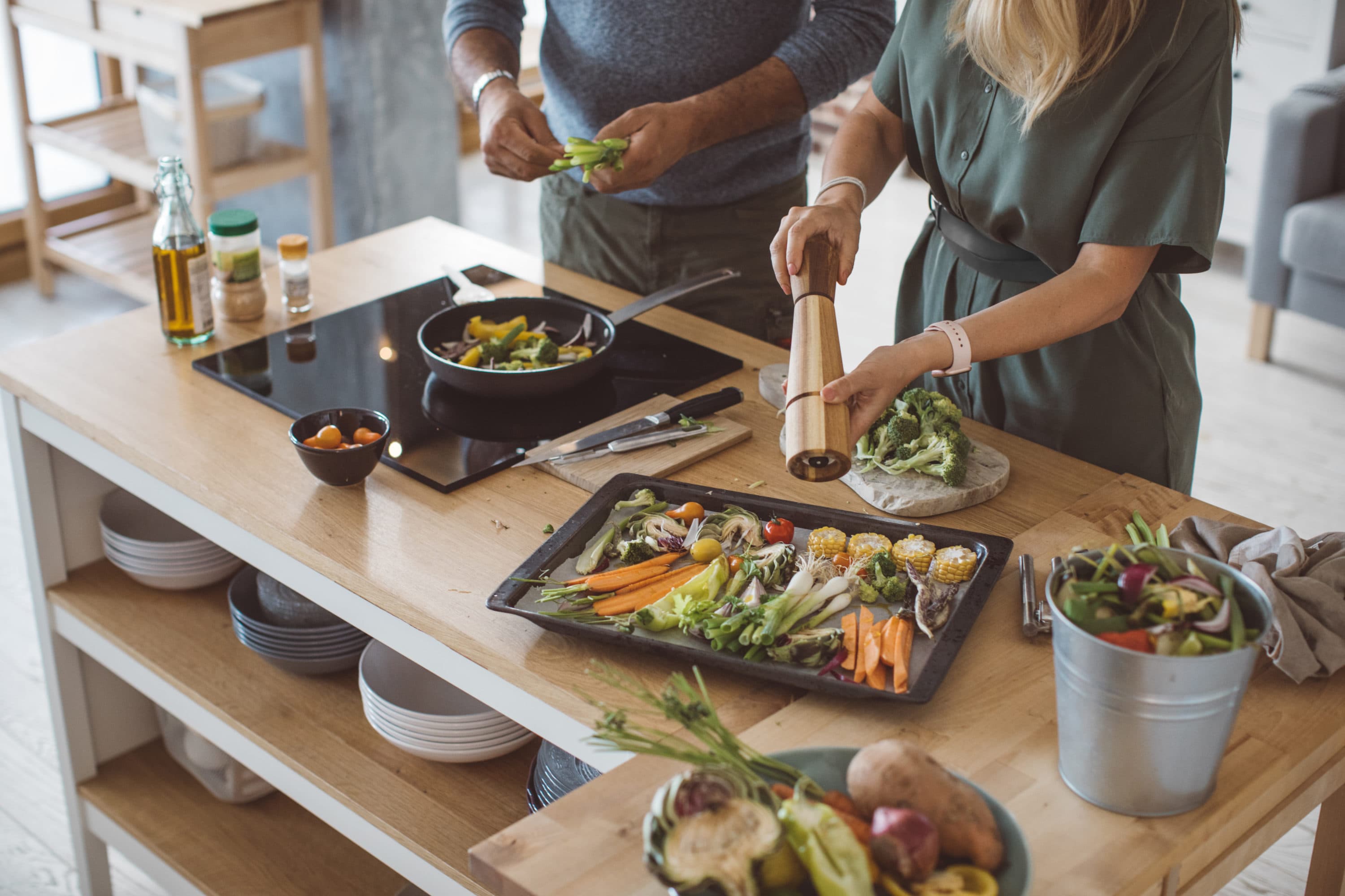 A couple preparing a colorful meal. (Getty Images)