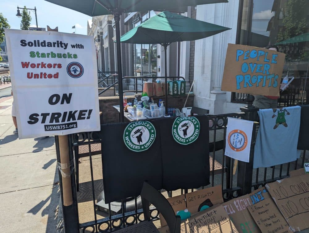 Pro-union signs and T-shirts outside the Starbucks at 874 Commonwealth Avenue in Brookline. (Chris Citorik/WBUR)